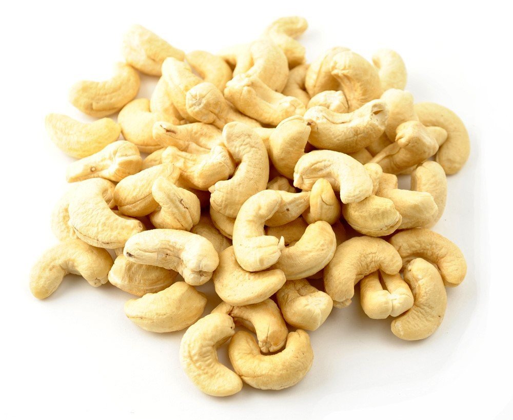 Raw Cashews on white ground  by Anna and Sarah